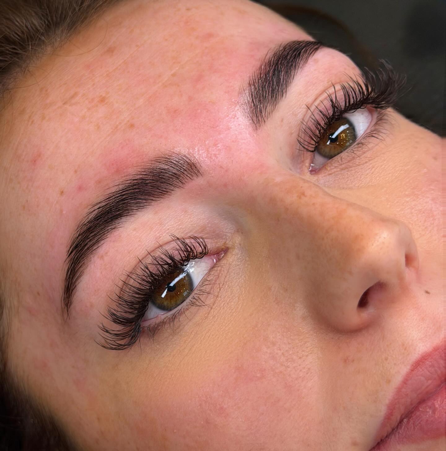 Shaped and tinted brows with lifted lashes, close up