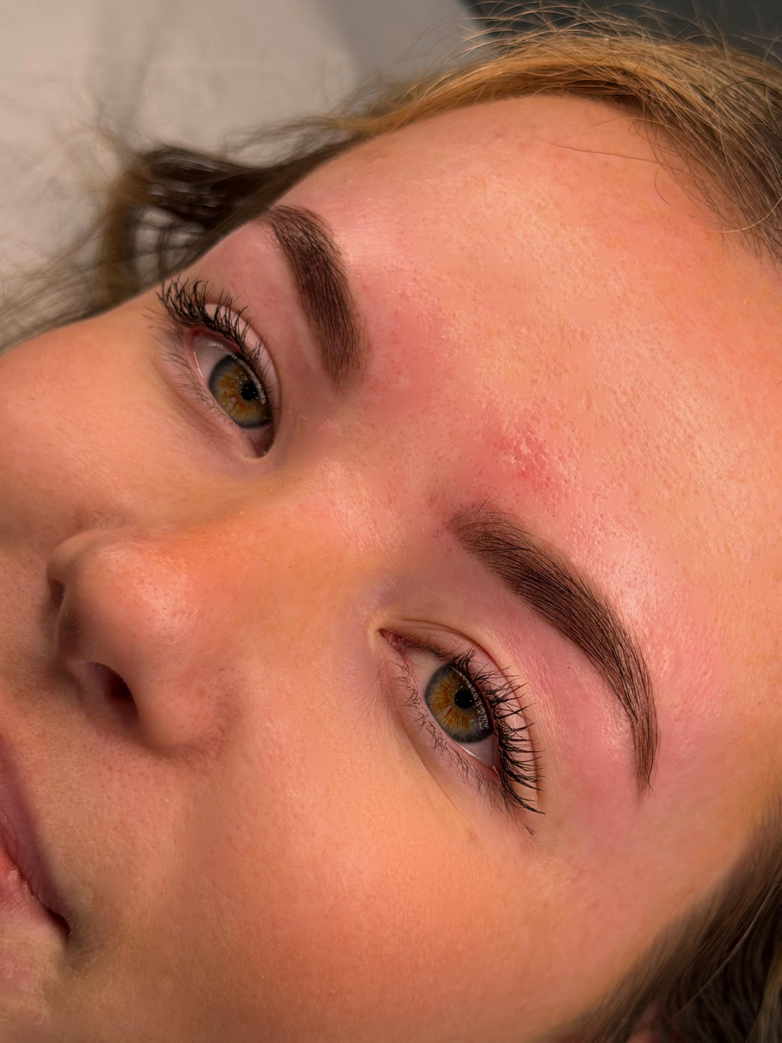 Laminated, tinted brows and a lash lift on a client
